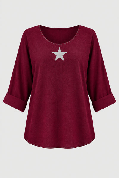 Puuvillaneulospaita Cristinessä hopeinen tähti edessä. Susanne